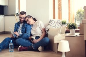 Young couple buys a new home and moves in